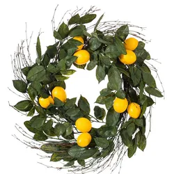A wreath made of green leaves, small twigs, and several artificial lemons.