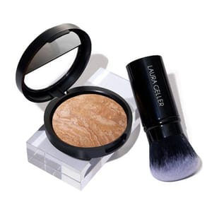 Laura Geller 2-piece set includes a baked bronzer with a marbled design in a round compact, accompanied by a dual-ended kabuki brush with \“LAURA GELLER\“ printed on the handle.