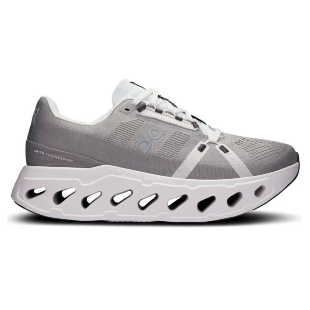 Running shoe with a unique cushioned sole featuring large cutouts and a minimalist design. Gray upper with white laces and accents.