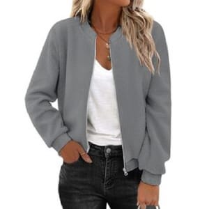 A gray bomber jacket is paired with a white T-shirt and dark jeans, accessorized with layered necklaces.