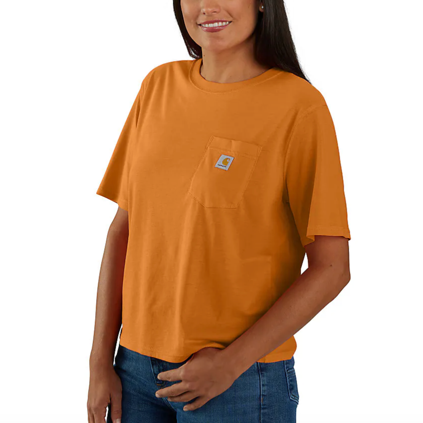 Orange short-sleeve t-shirt with a chest pocket featuring a small logo, paired with blue jeans.