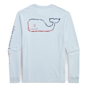 Light blue long-sleeve t-shirt featuring a distressed burgee pattern whale graphic on the back and \“Vineyard Vines\“ text on the sleeve.