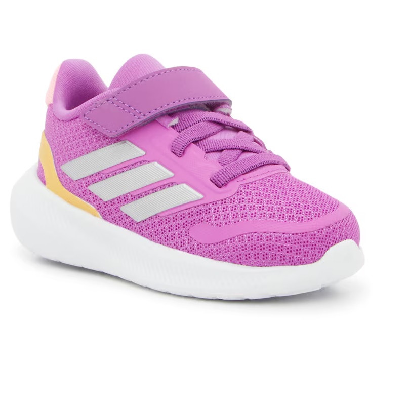 A brightly colored child's sneaker in pink and yellow with velcro straps and a breathable mesh fabric.