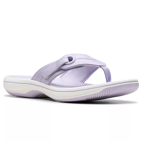 A lavender flip-flop sandal featuring a cushioned white sole and a strap with a loop detail for comfort and style.
