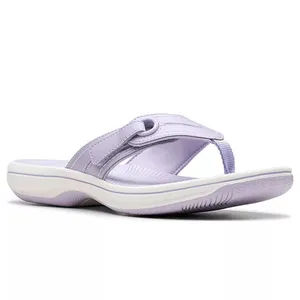 A lavender flip-flop sandal featuring a cushioned white sole and a strap with a loop detail for comfort and style.