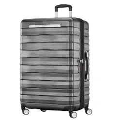 A large hard-shell suitcase with a sleek, textured design, four spinner wheels, and a retractable handle.