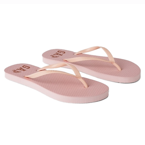 Pink rubber flip flops with a textured sole and slim straps, featuring the GAP logo printed on the footbed.