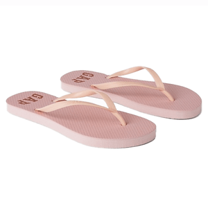 Pink rubber flip flops with a textured sole and slim straps, featuring the GAP logo printed on the footbed.