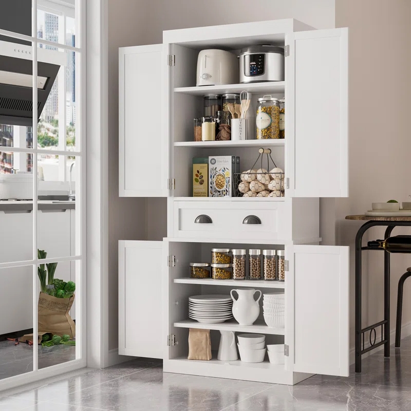 A 71\“ white kitchen pantry cabinet with double doors features open shelves storing small appliances, jars, canned goods, and bowls. It includes drawers for additional storage and a bottom section with dishes and pitchers, providing organized kitchen space.