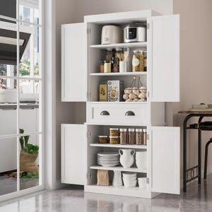 A 71\“ white kitchen pantry cabinet with double doors features open shelves storing small appliances, jars, canned goods, and bowls. It includes drawers for additional storage and a bottom section with dishes and pitchers, providing organized kitchen space.
