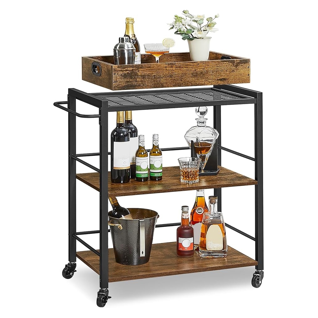 A rolling bar cart with three wooden shelves and a black metal frame holds various bottles, a decanter, ice bucket, and a serving tray with glasses and a potted plant on top.