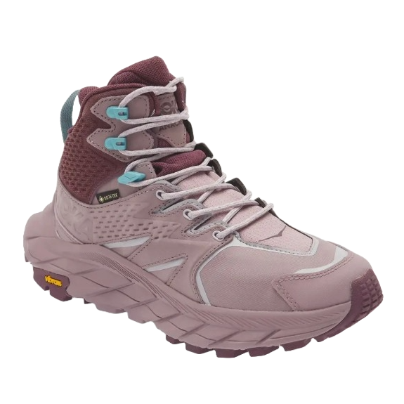 Hoka women's Anacapa hiking shoes are mid-cut, waterproof boots with a Vibram sole, designed for trail use. They feature a pink and maroon color scheme with light blue accents and GORE-TEX technology for enhanced weather protection.