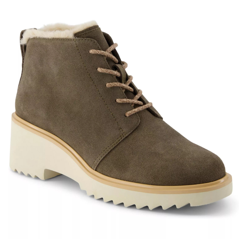 A taupe suede ankle boot with a chunky cream block heel and lace-up design, featuring a soft plush lining.