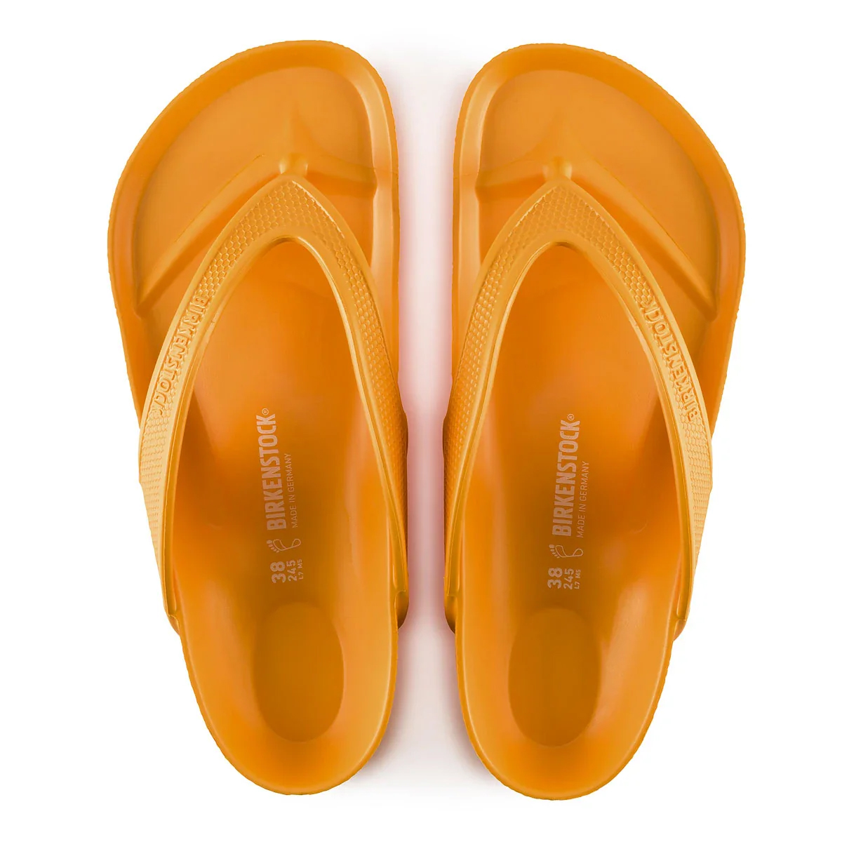 A pair of orange Birkenstock flip-flops with the brand's name embossed on the straps and footbed.