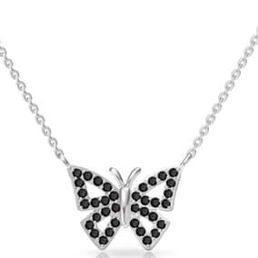 Silver butterfly pendant necklace with a chain, adorned with black inset stones.