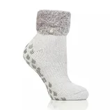 A gray ankle sock with a fluffy cuff and non-slip grip soles, featuring a small tag on the cuff.
