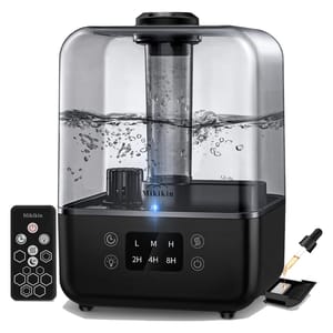 An ultrasonic cool mist humidifier with a remote control and essential oil diffuser compartment.