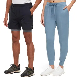 On the left, men's black athletic shorts paired with running shoes; on the right, a person in blue jogger pants with white sneakers.