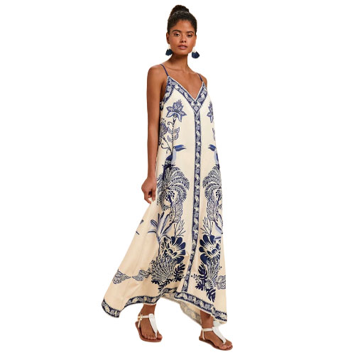 Sleeveless maxi dress with spaghetti straps, featuring a cream base and blue floral patterns, paired with sandals.