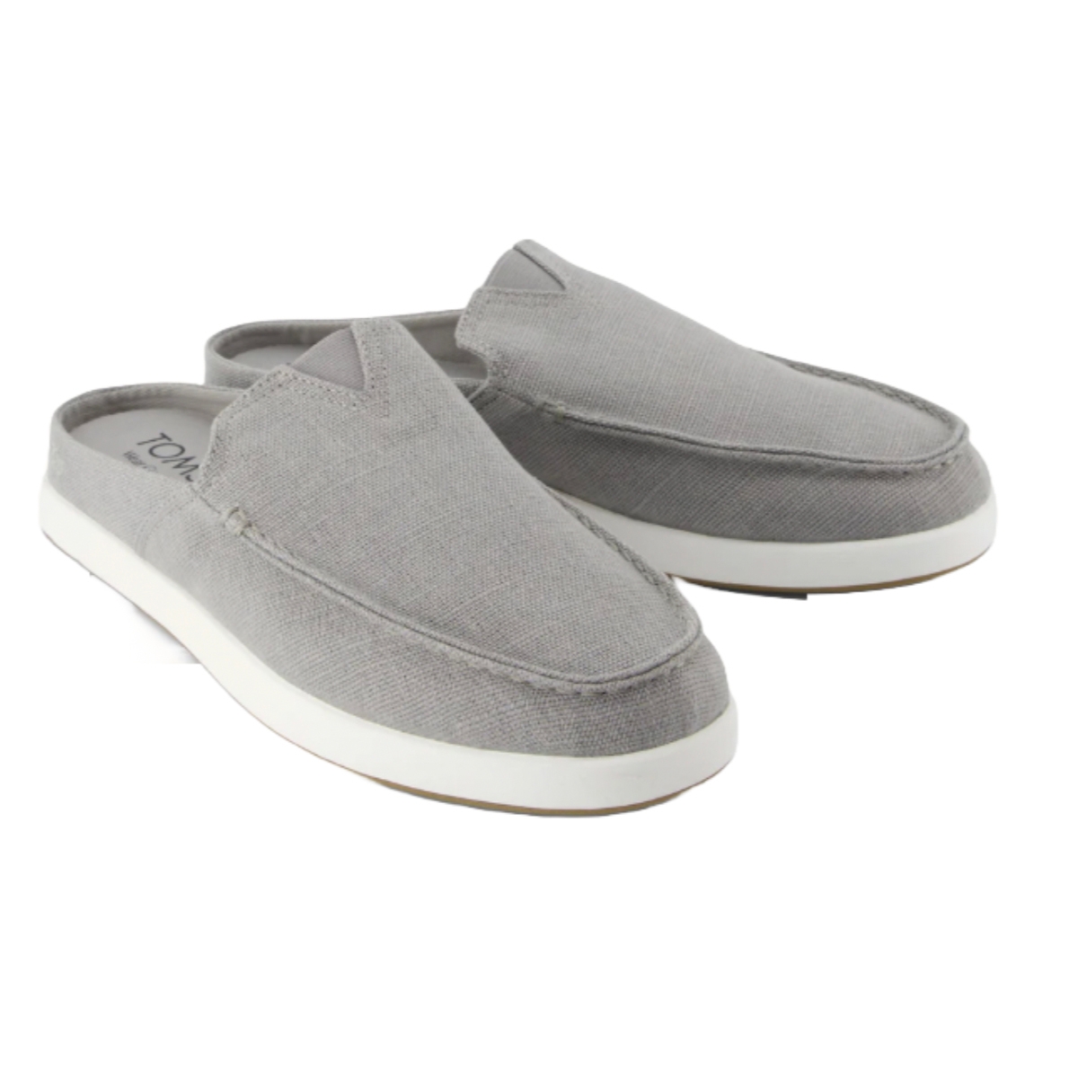 Gray slip-on loafers with a textured fabric, featuring a white sole and backless design.