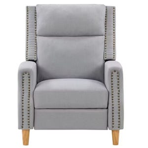 A gray upholstered armchair with studded detailing and wooden legs.