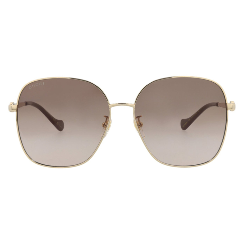 Gucci sunglasses with square, oversized frames feature gold-tone metal and gradient brown lenses. The glasses have thin arms and a subtle Gucci logo on the top corner of one lens.