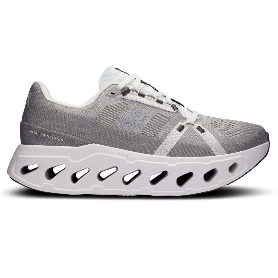 Athletic shoe with a thick, vented white sole and a gray mesh upper featuring the \“On\“ logo, designed with Swiss engineering.