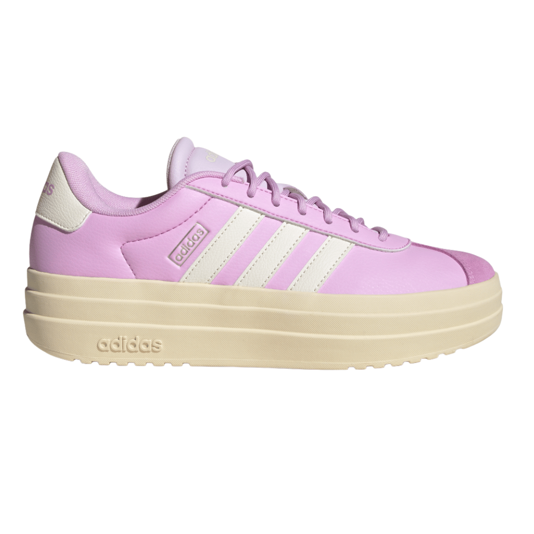 Adidas platform sneakers in pink with cream stripes and sole.