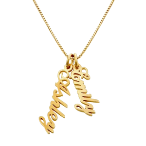 A gold necklace features three pendant charms with the names \“Ashley,\“ \“Emily,\“ and \“Tommy\“ in cursive script.