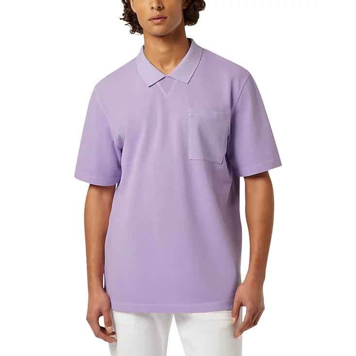 A man is wearing a light purple short-sleeve polo shirt with a chest pocket, paired with white pants.