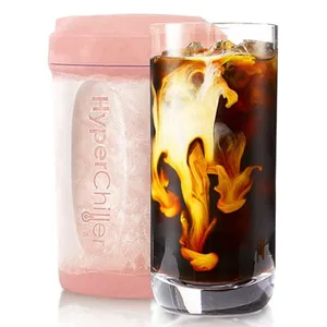 A pink HyperChiller is paired with a glass of iced coffee swirling with cream.