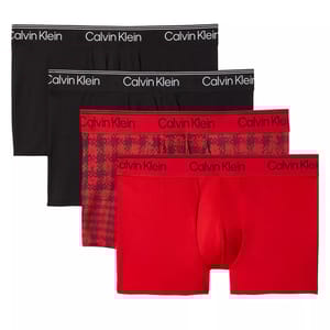 Four pairs of Calvin Klein boxer briefs in black and red, featuring solid colors and a red patterned design, with the Calvin Klein logo on the waistband.