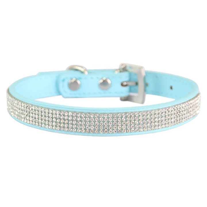 Light blue collar adorned with several rows of sparkling rhinestones and featuring a metal buckle for fastening.