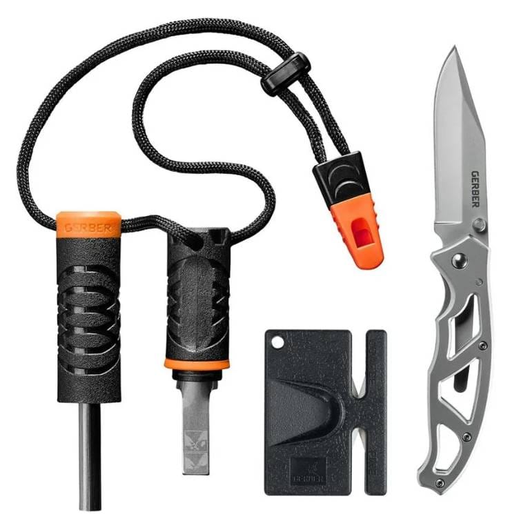 Fire starter with striker and lanyard, a compact knife with a cutout handle, and a black credit card-sized multi-tool.