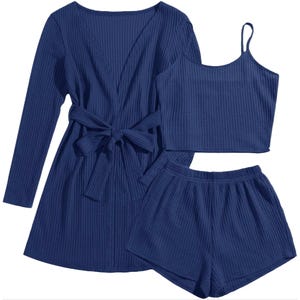 Three-piece blue loungewear set with a long-sleeve tie-front cardigan, a sleeveless crop top, and elastic waist shorts. Made from a textured fabric.