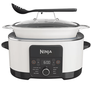Ninja slow cooker and multi-cooker with a control panel featuring modes for slow cook, sear/sauté, steam, keep warm, sous vide, braise, bake, and proof. Includes a glass lid and a slotted spoon.