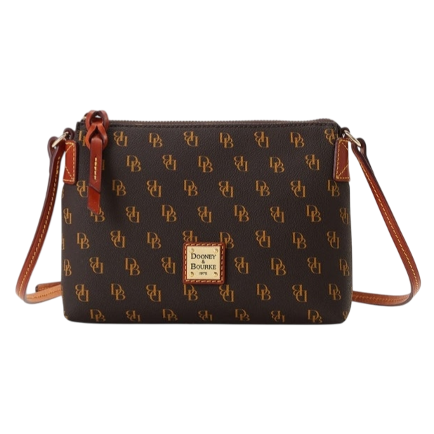 A Dooney & Bourke crossbody bag with a brown monogram pattern featuring \“DB\“ initials, a leather strap, and a logo patch on the front.