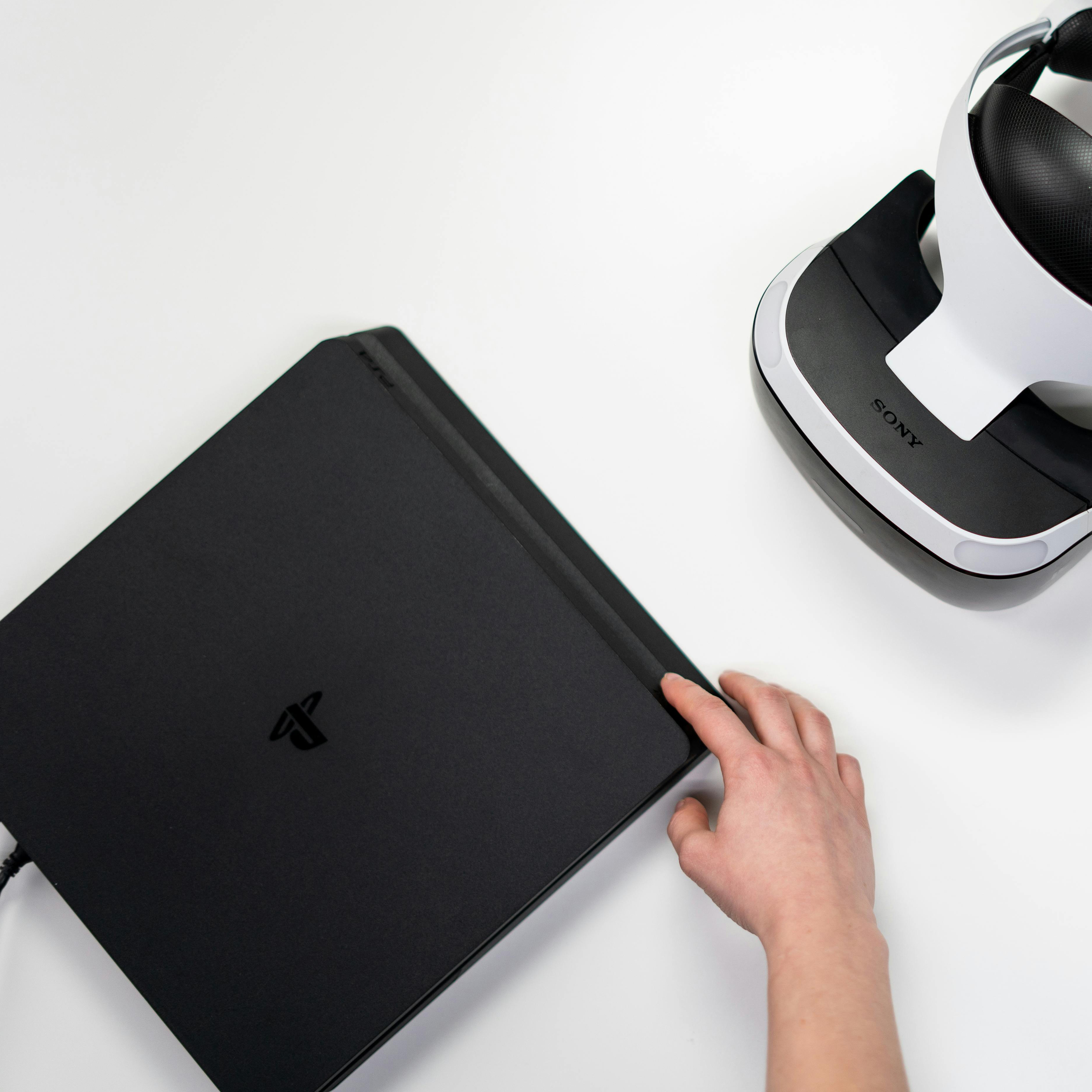 A PlayStation console and a virtual reality (VR) headset.