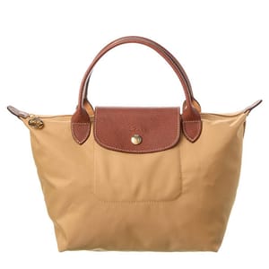 Tan handbag with brown leather handles and a flap closure.