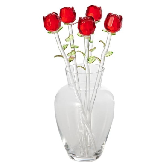 A set of six glass roses with red petals and green leaves in a clear, elegant vase. The stems are slender and transparent, creating a decorative floral arrangement.