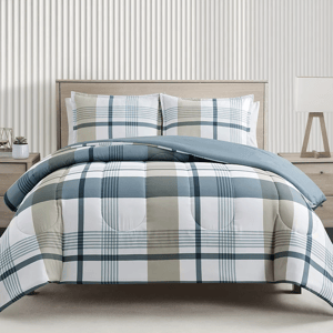 A bed with a blue and beige plaid comforter set including pillows.