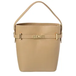 A beige leather bucket bag with a single handle, featuring gold-tone hardware and a decorative clasp in the center.