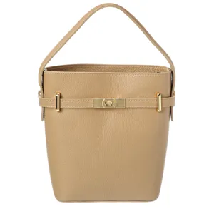 A beige leather bucket bag with a single handle, featuring gold-tone hardware and a decorative clasp in the center.