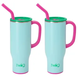 Two light blue insulated mugs with pink handles, green lids, and pink straws. The brand name \“swig\“ appears on each mug.