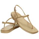 A pair of gold slingback thong sandals with a minimalist design and strap details.
