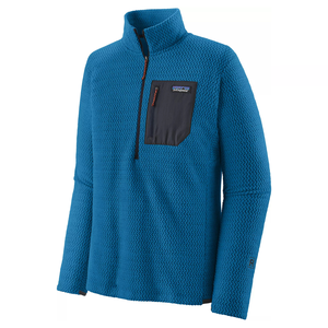 Blue textured zip-neck pullover with a dark chest pocket featuring a horizontal zipper and brand label.
