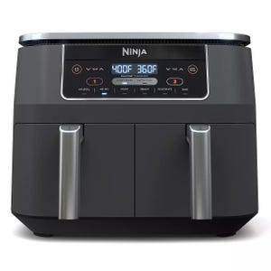 Ninja dual-zone air fryer with two cooking compartments, featuring a digital display and multiple cooking settings including air broil, air fry, roast, reheat, dehydrate, and bake.