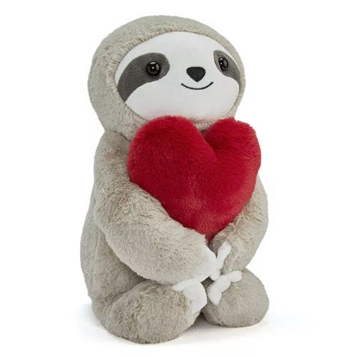 a plushie sloth holding a heart