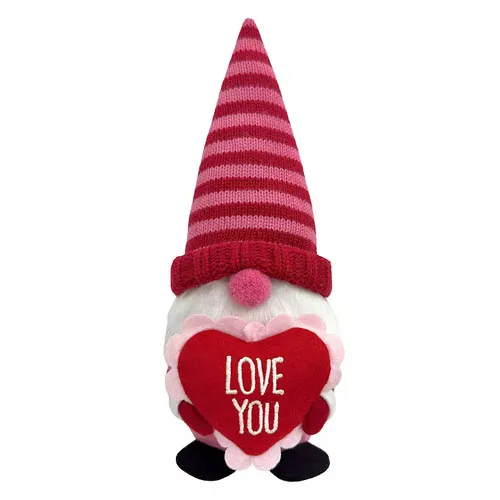 A plush gnome with a striped red and pink hat, holding a heart that says \“Love You.\“