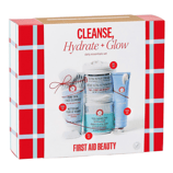 First Aid Beauty's \“Cleanse, Hydrate + Glow\“ set includes Pure Skin Face Cleanser (travel size), Ultra Repair Cream (mid-size), and Facial Radiance Pads (full size), all aimed at enhancing skincare routines.